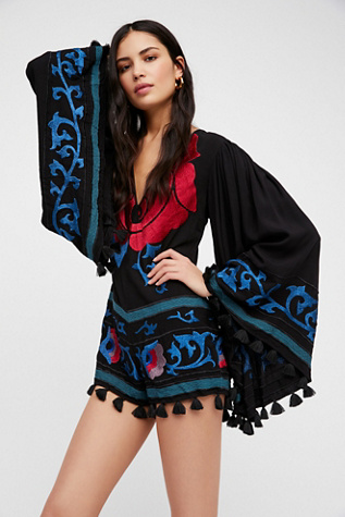 Dramatic bell sleeved romper with pom details